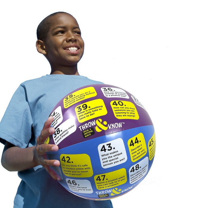 Boy holding Social & Emotional Health Throw & Know Activity Ball, inflatable health education ball , Health Edco, 78008